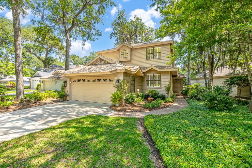 35 Bay Tree Court East St. Simons, GA 31522 - Photo 1 of 1 a front view of a house with garden