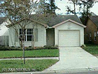 2427 Wattle Tree Road East Jacksonville, FL 32246 - Photo 1 of 1 a front view of a house with a yard