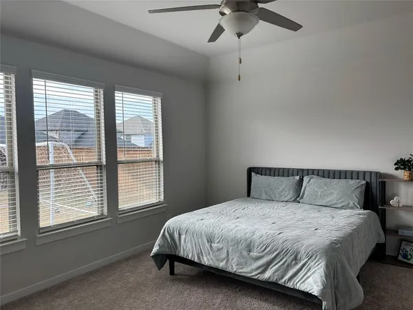 a bathroom with a double vanity sink mirror and shower