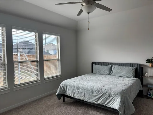 a bathroom with a double vanity sink mirror and shower