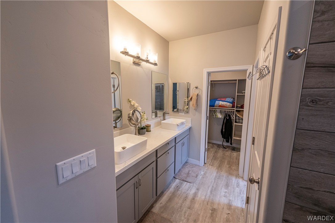 3566 North Kenneth Road Kingman, AZ 86409 - Photo 14 of 35 a bathroom with a sink a mirror and a shower