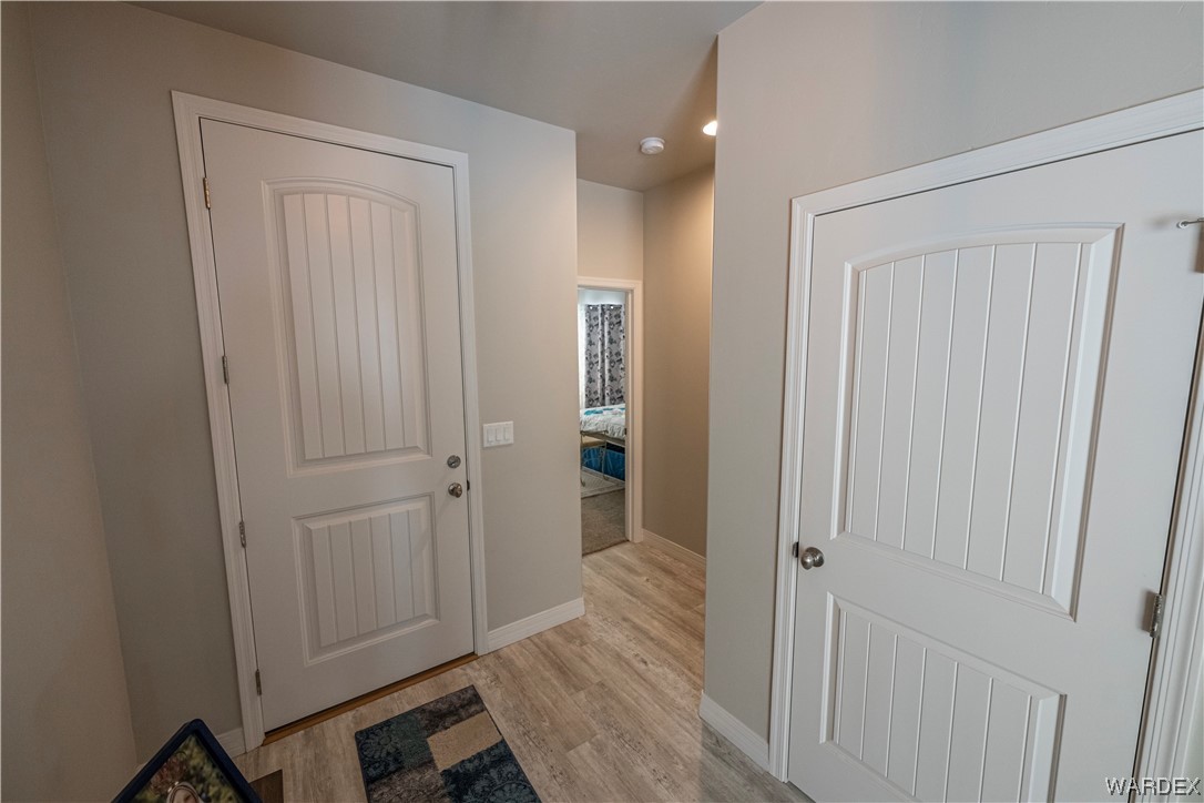 3566 North Kenneth Road Kingman, AZ 86409 - Photo 4 of 35 a view of a hallway with wooden floor