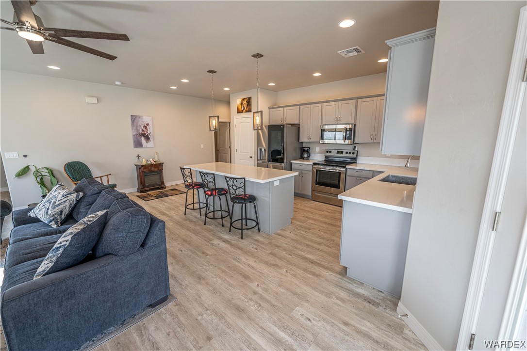 3566 North Kenneth Road Kingman, AZ 86409 - Photo 6 of 35 a living room with furniture and a wooden floor