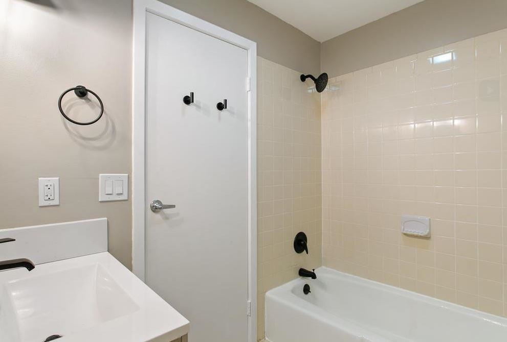 475 Palisade Avenue, Unit 4 Jersey City, NJ 07307 - Photo 12 of 16 a bathroom with a bathtub and shower