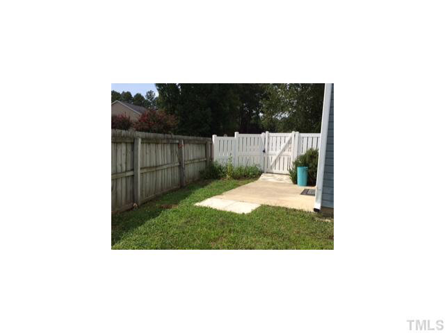 3100 Marcony Way Raleigh, NC 27610 - Photo 3 of 14 a picture of a bench in front of a gate