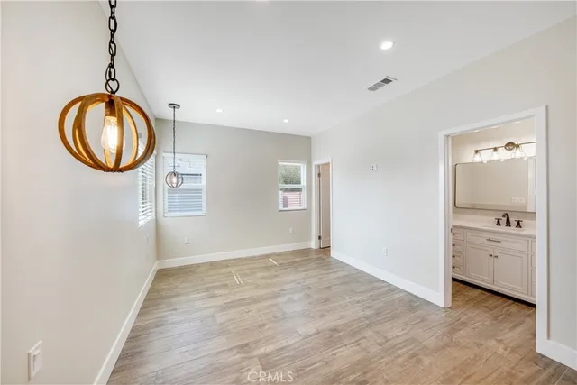 wooden floor in an empty room and a window