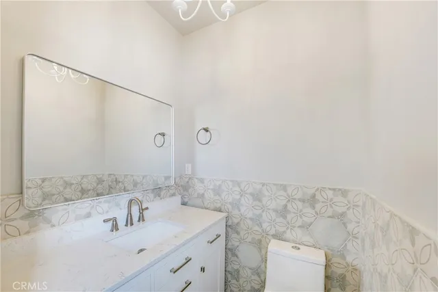 a bathroom with a sink and mirror
