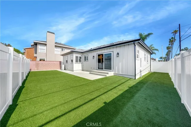 a front view of a house with yard and green space