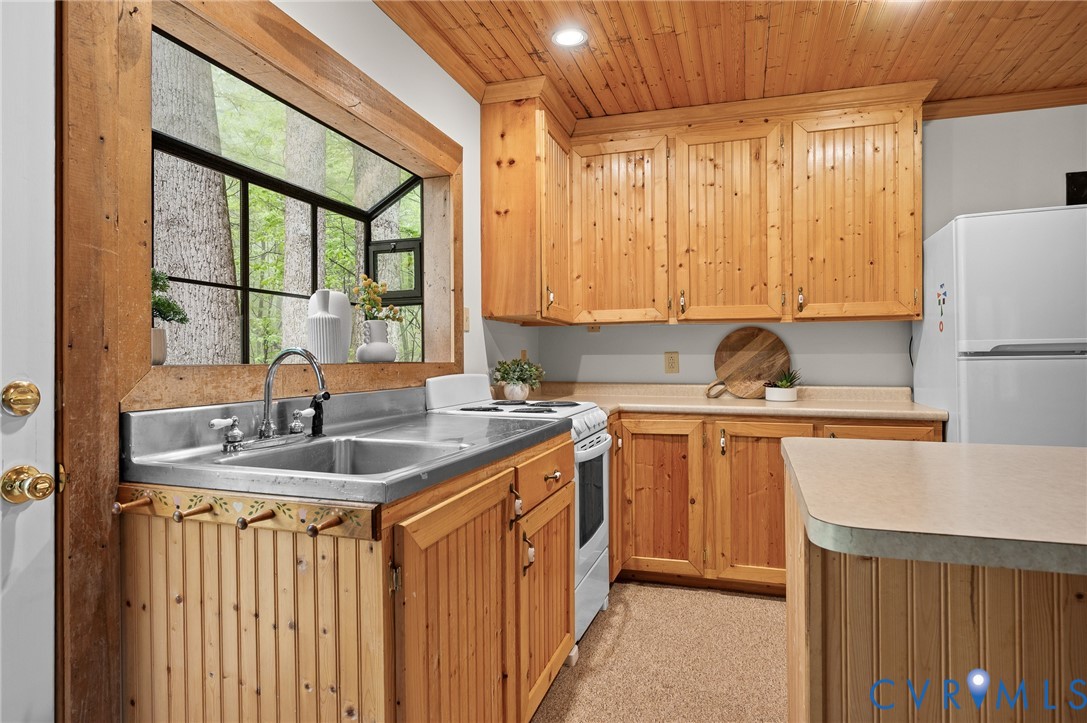 270 Little Cabin Road Amherst, VA 24521 - Photo 9 of 52 a kitchen with stainless steel appliances granite countertop a sink stove and cabinets