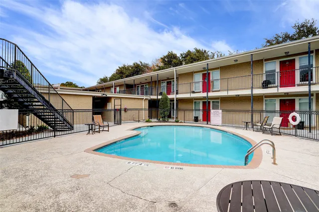 a view of pool with outdoor seating