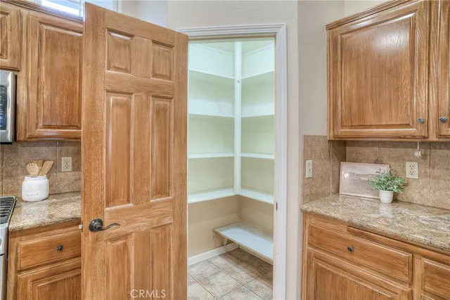 a bathroom with a sink double vanity granite and a mirror