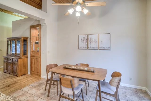 a living room with stainless steel appliances kitchen island granite countertop furniture and a view of kitchen