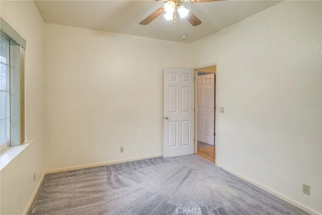 a view of a bedroom with washer and dryer