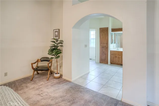 a spacious bathroom with a double vanity sink a mirror and a shower