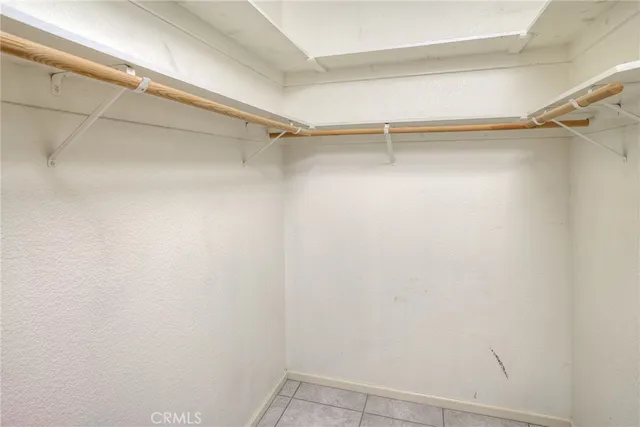 a view of a patio with table and chairs potted plants with wooden floor and fence