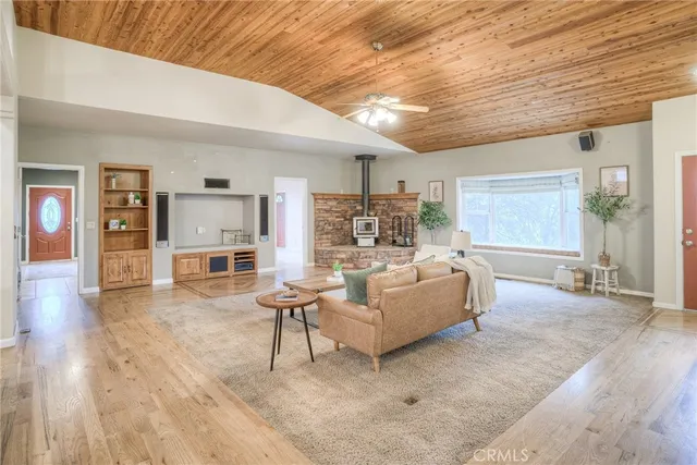 a kitchen with stainless steel appliances kitchen island granite countertop a refrigerator and a sink