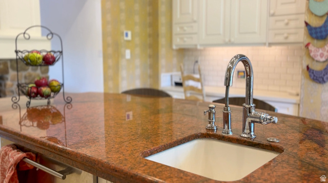 426 West Center Street Parowan, UT 84761 - Photo 18 of 107 Kitchen island featuring a polished granite countertop, undermount sink, and polished chrome faucet