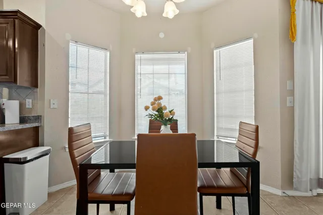 a kitchen with stainless steel appliances granite countertop a stove refrigerator sink and cabinets