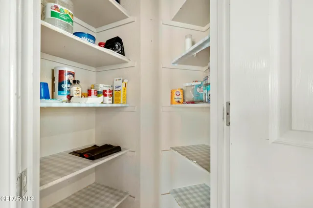 a bathroom with a sink mirror and toilet