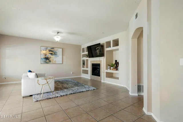 a bed sitting in a bedroom next to a bathroom