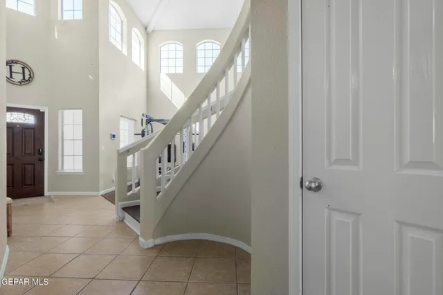 a bathroom with a double vanity sink mirror and shower