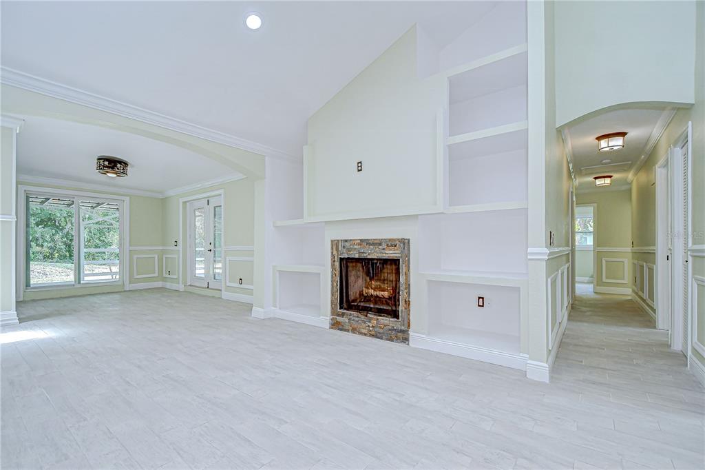 1931 Jaudon Road Dover, FL 33527 - Photo 14 of 50 a view of a livingroom with a fireplace and window
