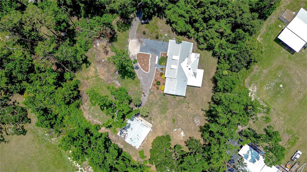1931 Jaudon Road Dover, FL 33527 - Photo 2 of 50 an aerial view of residential house with outdoor space and trees all around
