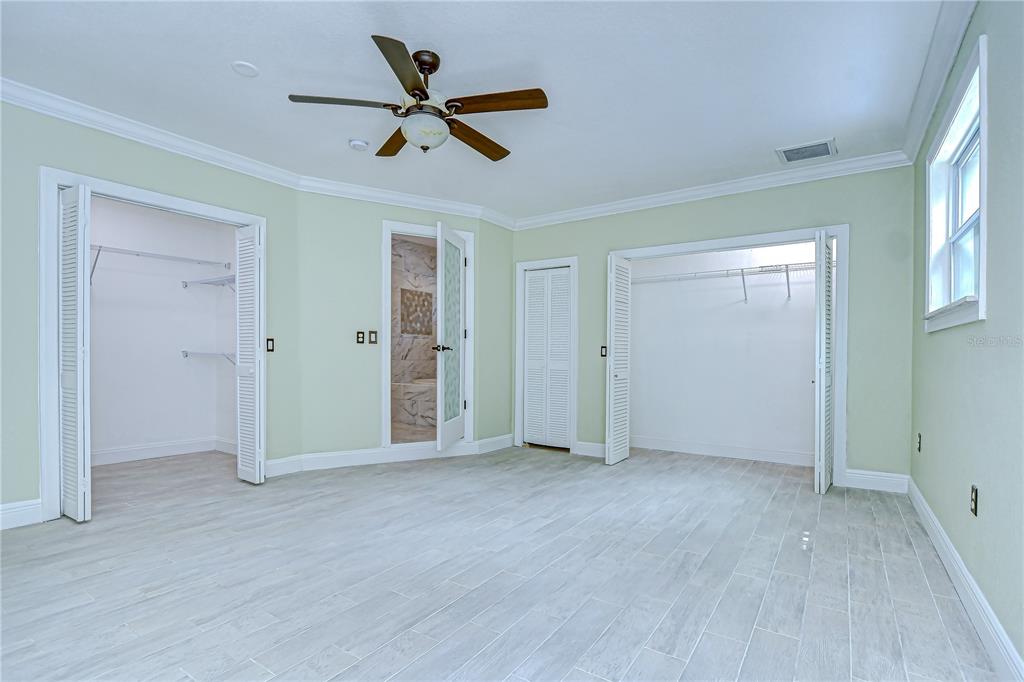 1931 Jaudon Road Dover, FL 33527 - Photo 24 of 50 an empty room with closet and a ceiling fan