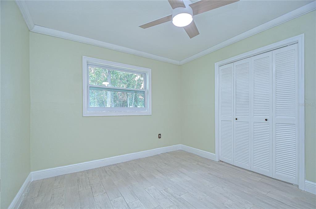 1931 Jaudon Road Dover, FL 33527 - Photo 28 of 50 wooden floor in an empty room with a window