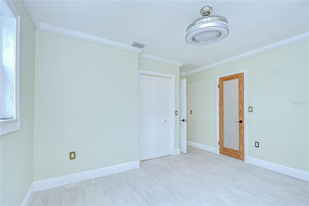 1931 Jaudon Road Dover, FL 33527 - Photo 31 of 50 a view of a room with an empty space and a ceiling fan