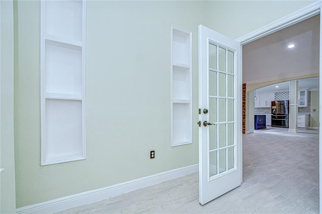1931 Jaudon Road Dover, FL 33527 - Photo 38 of 50 a view of a hallway with wooden shelves