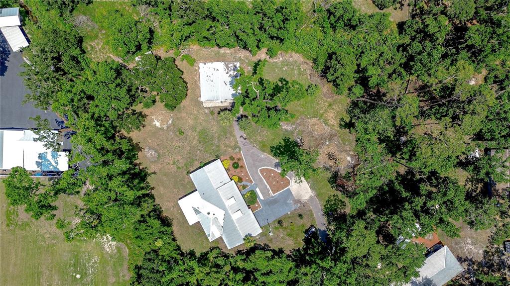 1931 Jaudon Road Dover, FL 33527 - Photo 45 of 50 an aerial view of residential house with outdoor space and trees all around