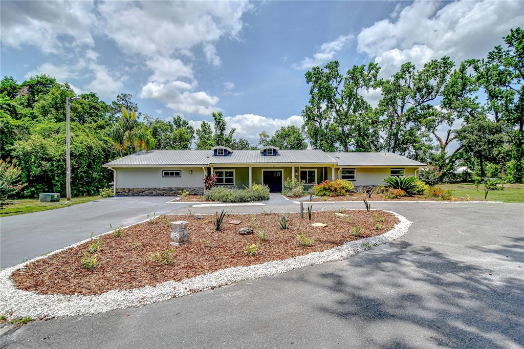 1931 Jaudon Road Dover, FL 33527 - Photo 48 of 50 a view of a house with a yard