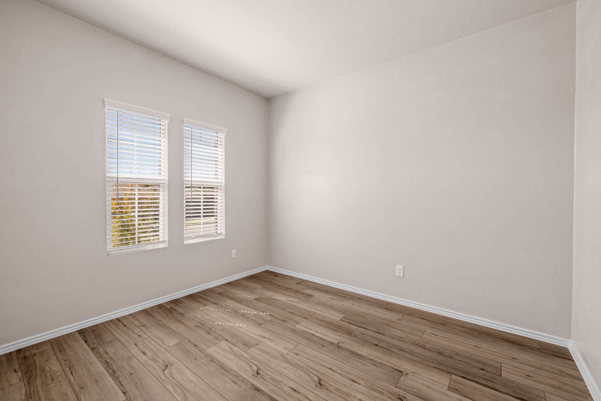 2309 Four Waters Loop Georgetown, TX 78628 - Photo 13 of 40 Unfurnished room featuring light wood-style floors and baseboards