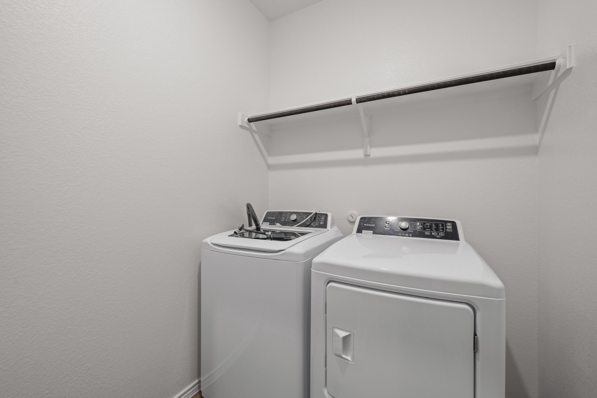 2309 Four Waters Loop Georgetown, TX 78628 - Photo 14 of 40 Laundry room with washer and dryer