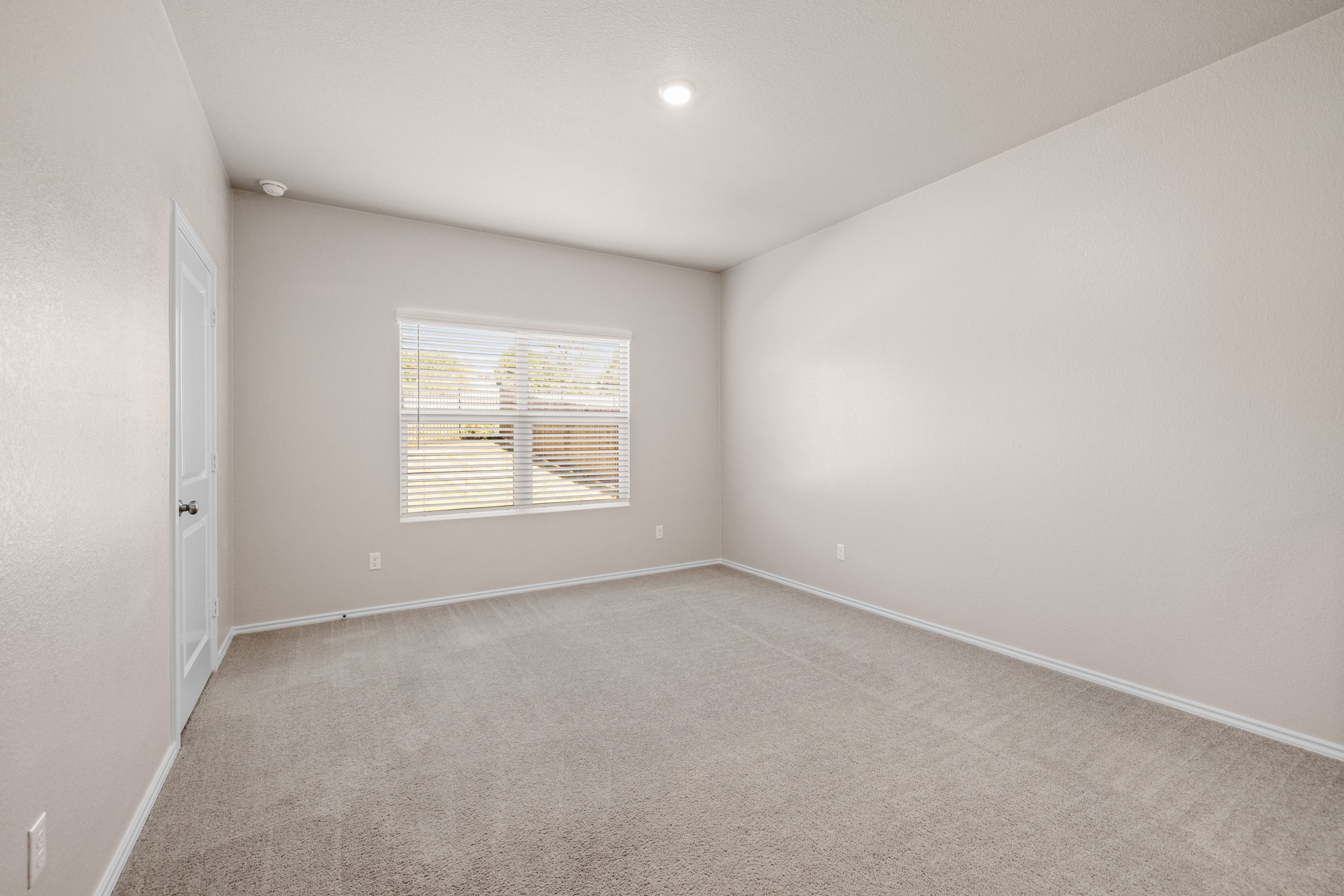 2309 Four Waters Loop Georgetown, TX 78628 - Photo 16 of 40 Empty room with light carpet