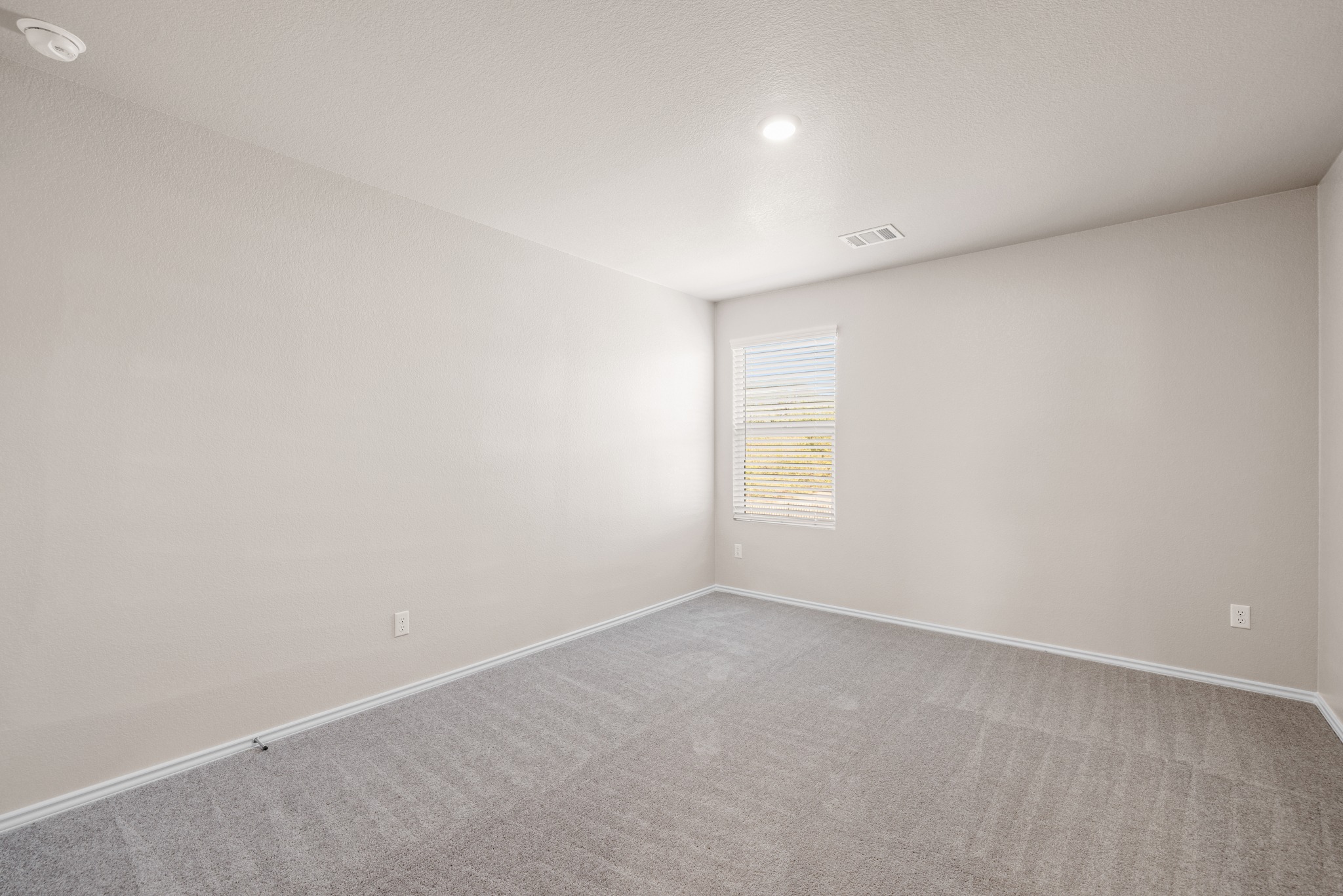 2309 Four Waters Loop Georgetown, TX 78628 - Photo 25 of 40 Spare room featuring carpet flooring and baseboards