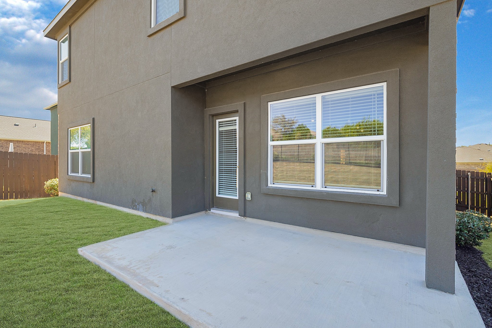 2309 Four Waters Loop Georgetown, TX 78628 - Photo 29 of 40 Rear view of property featuring stucco siding and a patio area