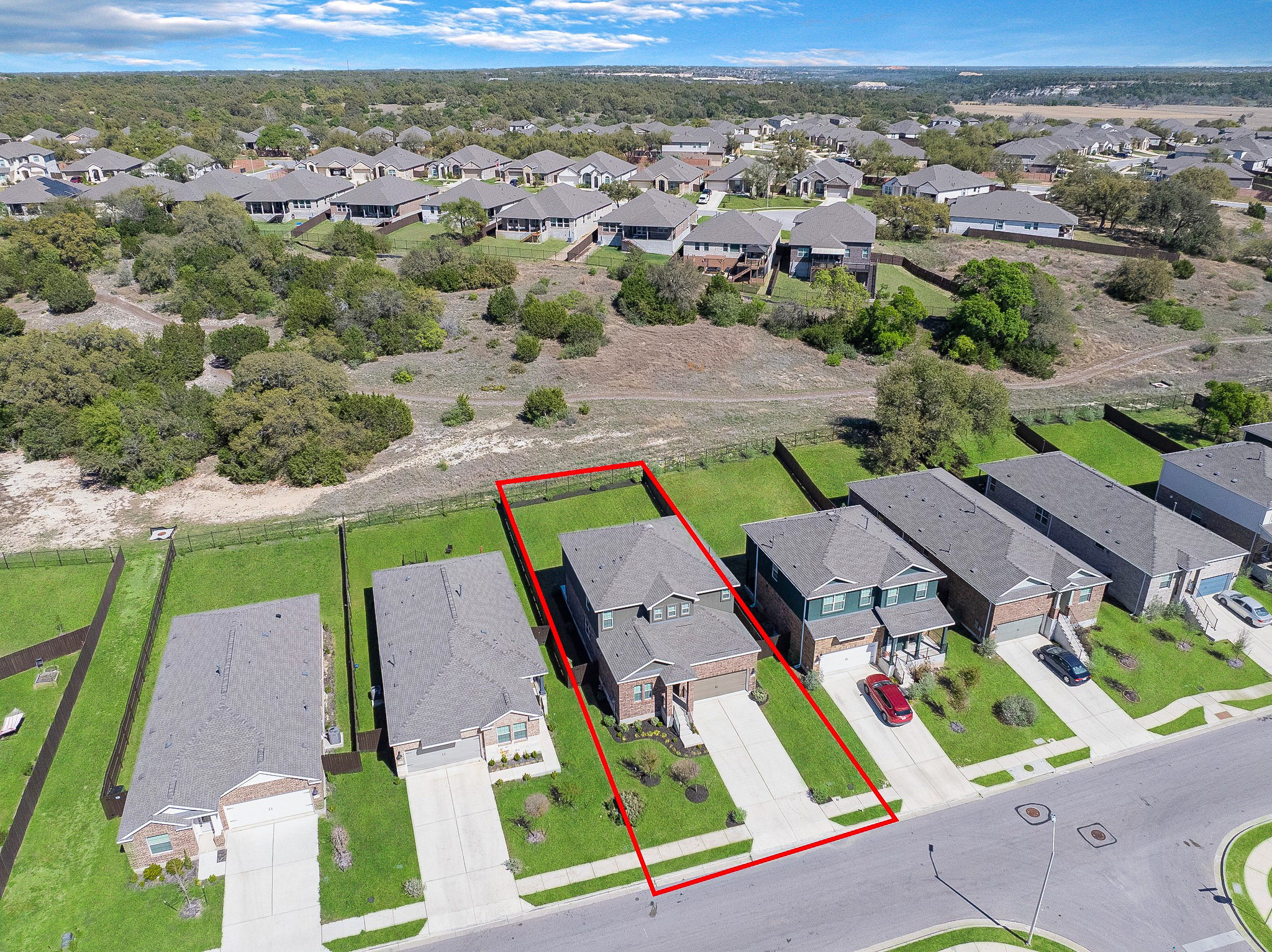 2309 Four Waters Loop Georgetown, TX 78628 - Photo 34 of 40 Aerial perspective of suburban area with property parcel outlined