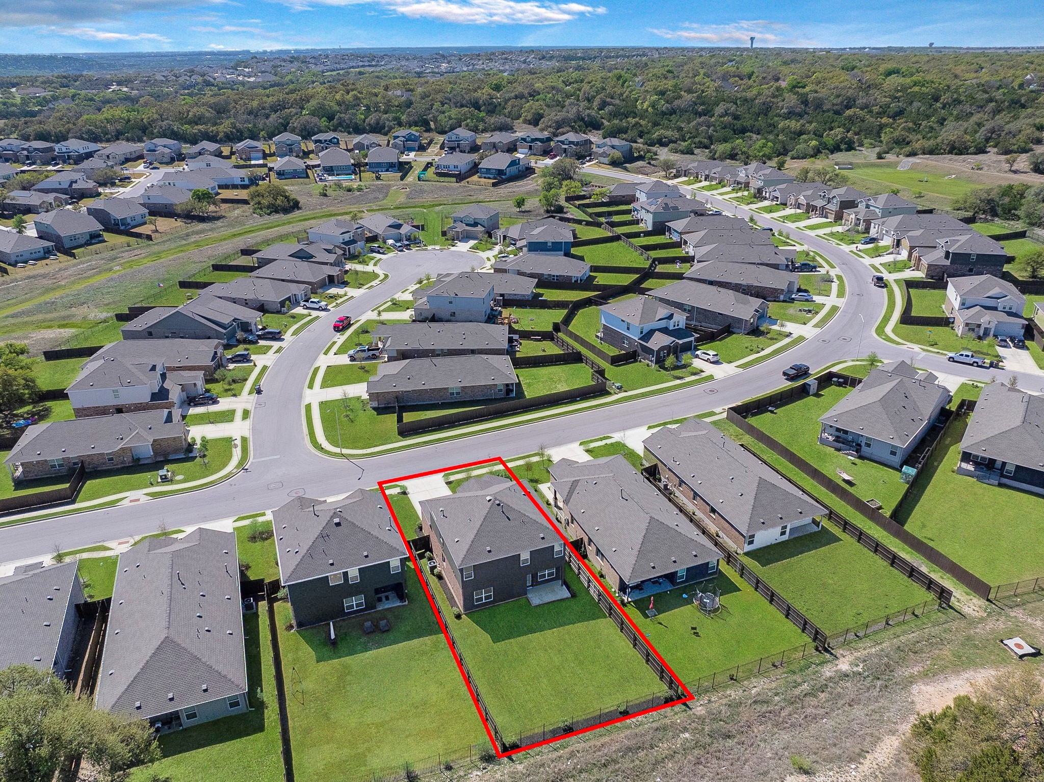 2309 Four Waters Loop Georgetown, TX 78628 - Photo 36 of 40 Aerial perspective of suburban area with property parcel outlined