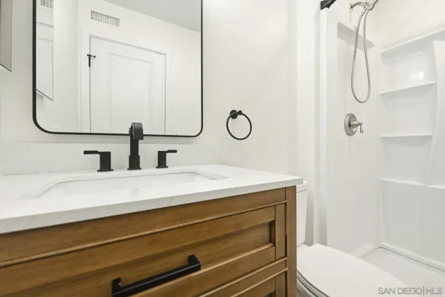 a bathroom with a sink and mirror