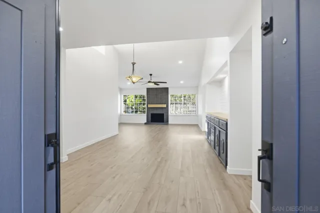 a view of a kitchen and a hallway