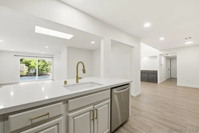 a kitchen with a sink and cabinets
