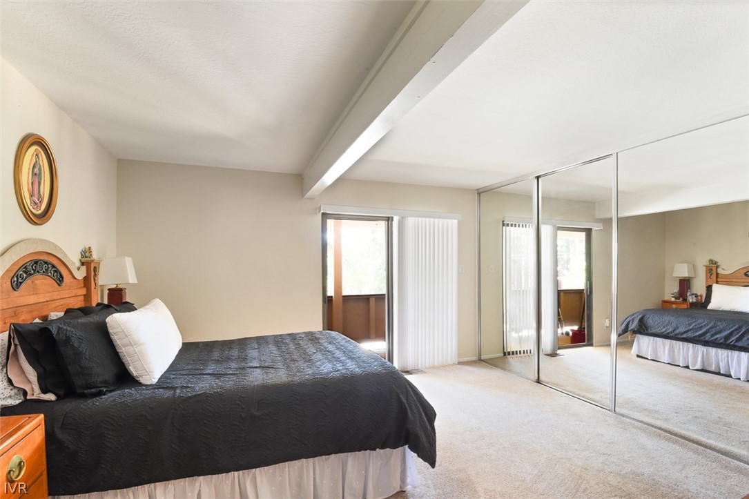 321 Ski Way Northeast, Unit 187 Incline Village, NV 89451 - Photo 12 of 18 a bedroom with a large bed and a couch