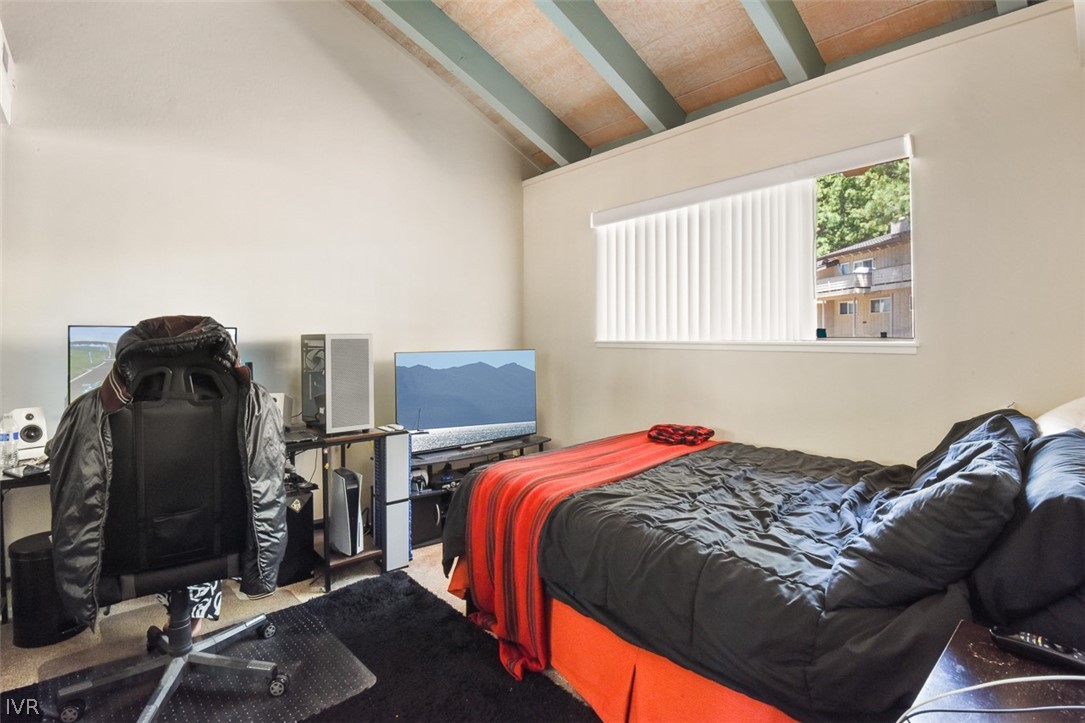 321 Ski Way Northeast, Unit 187 Incline Village, NV 89451 - Photo 15 of 18 a bed sitting in a bedroom next to a window with tv and closet