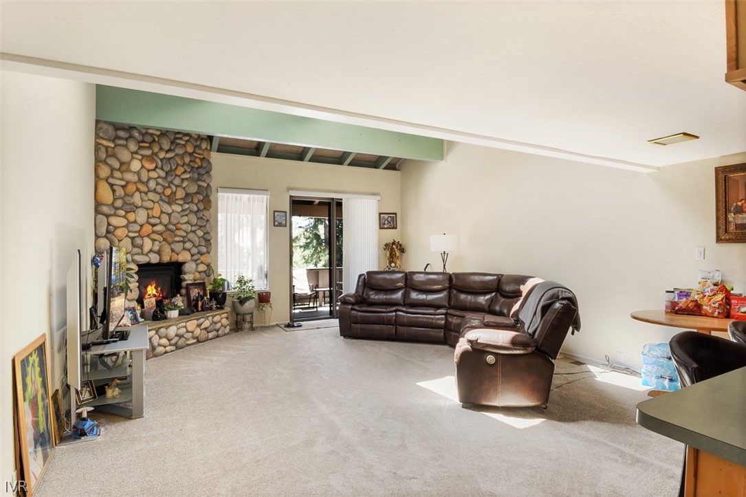 321 Ski Way Northeast, Unit 187 Incline Village, NV 89451 - Photo 4 of 18 a living room with furniture gym equipment and a fireplace