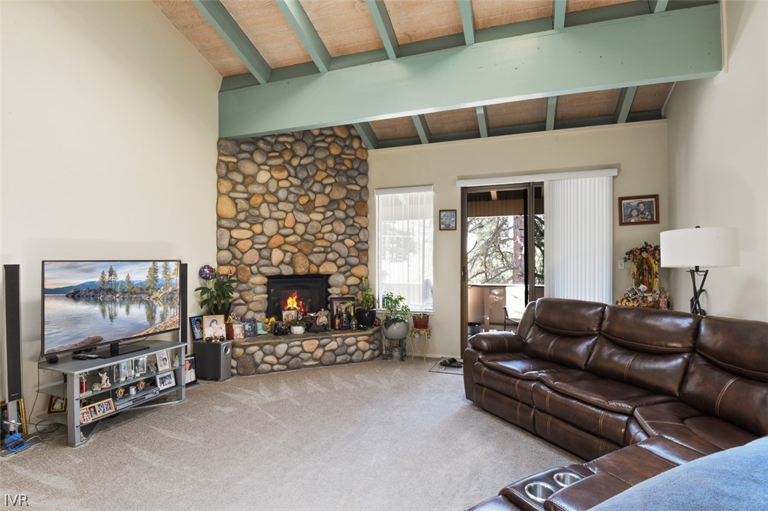 321 Ski Way Northeast, Unit 187 Incline Village, NV 89451 - Photo 5 of 18 a living room with furniture a flat screen tv and a fireplace