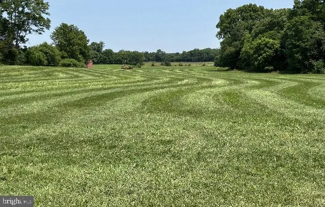 a view of a field with an outdoor space