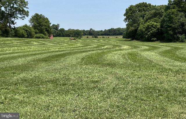 a view of a field with an outdoor space
