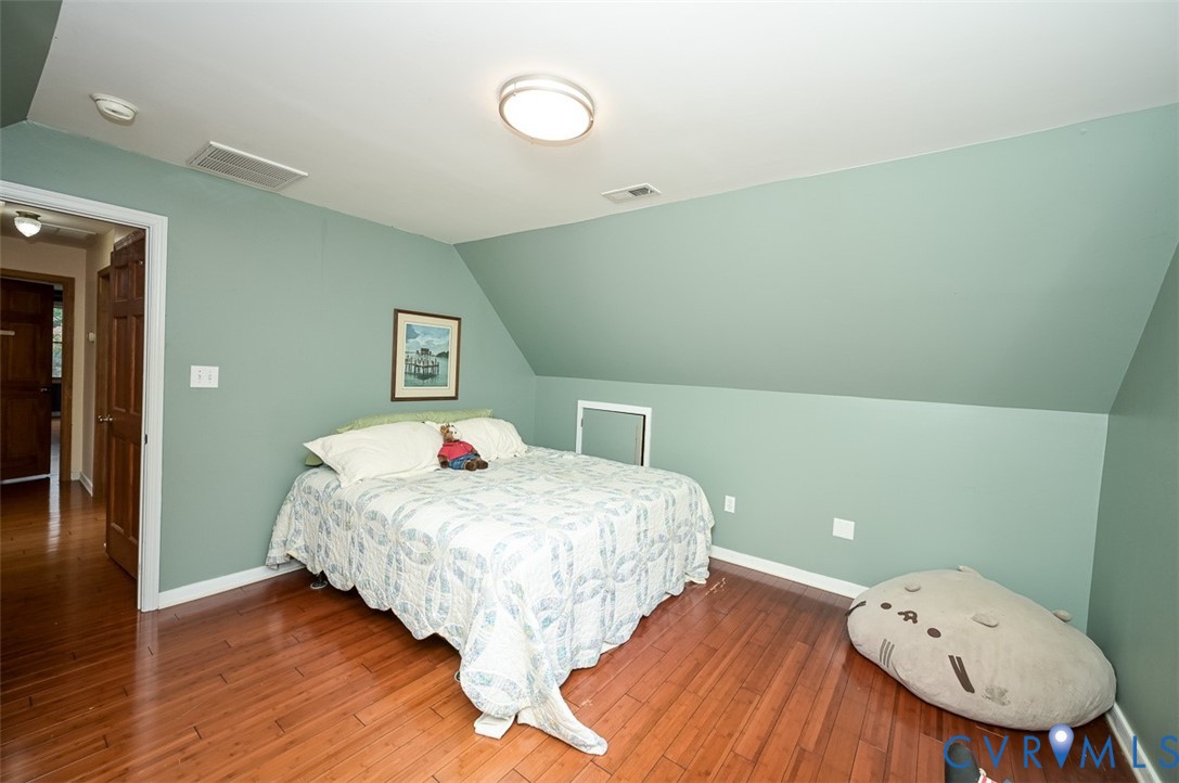 6040 Hare Road Henrico, VA 23231 - Photo 42 of 54 Sloped ceiling room featuring wood-finish flooring